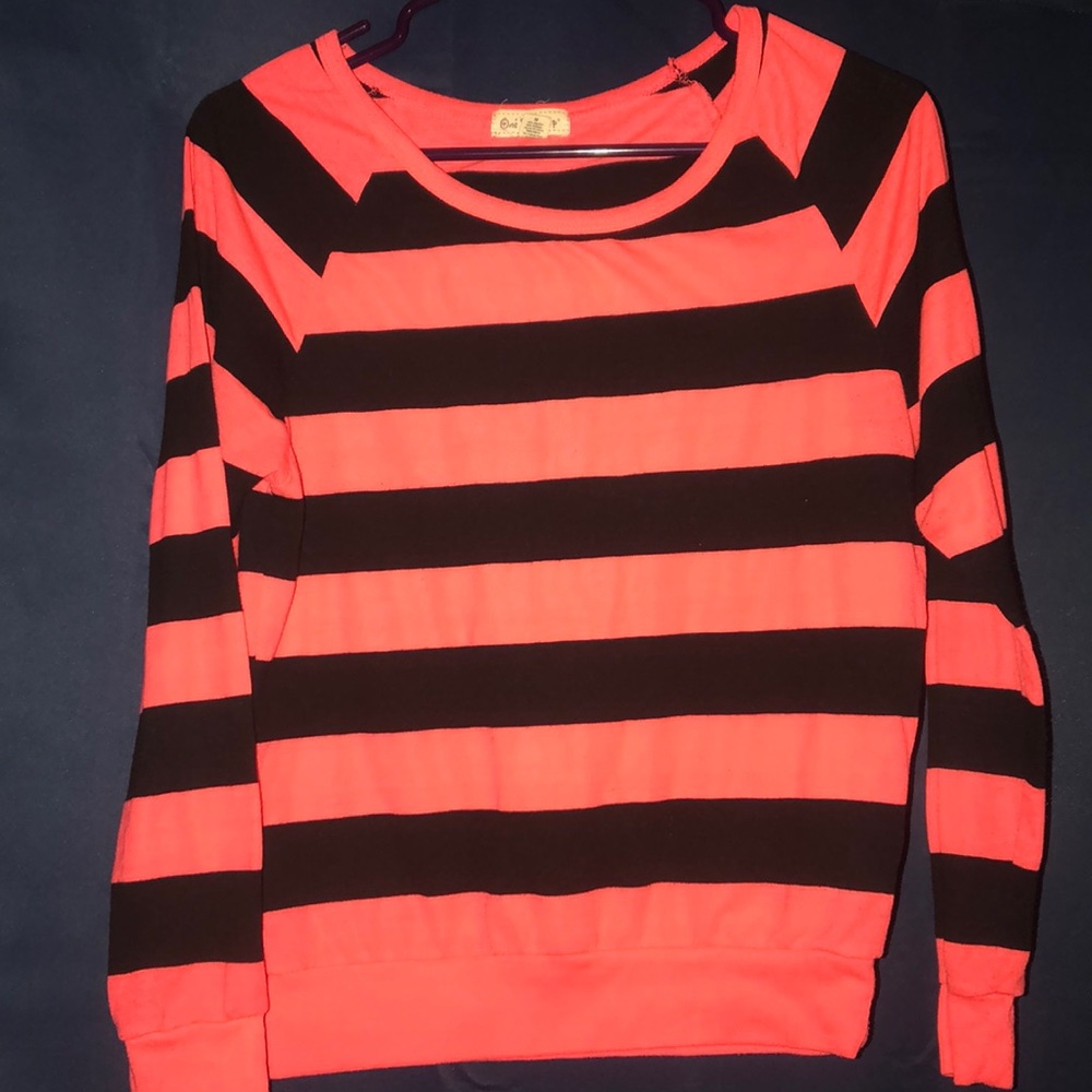 Orange and black striped long sleeve shirt.